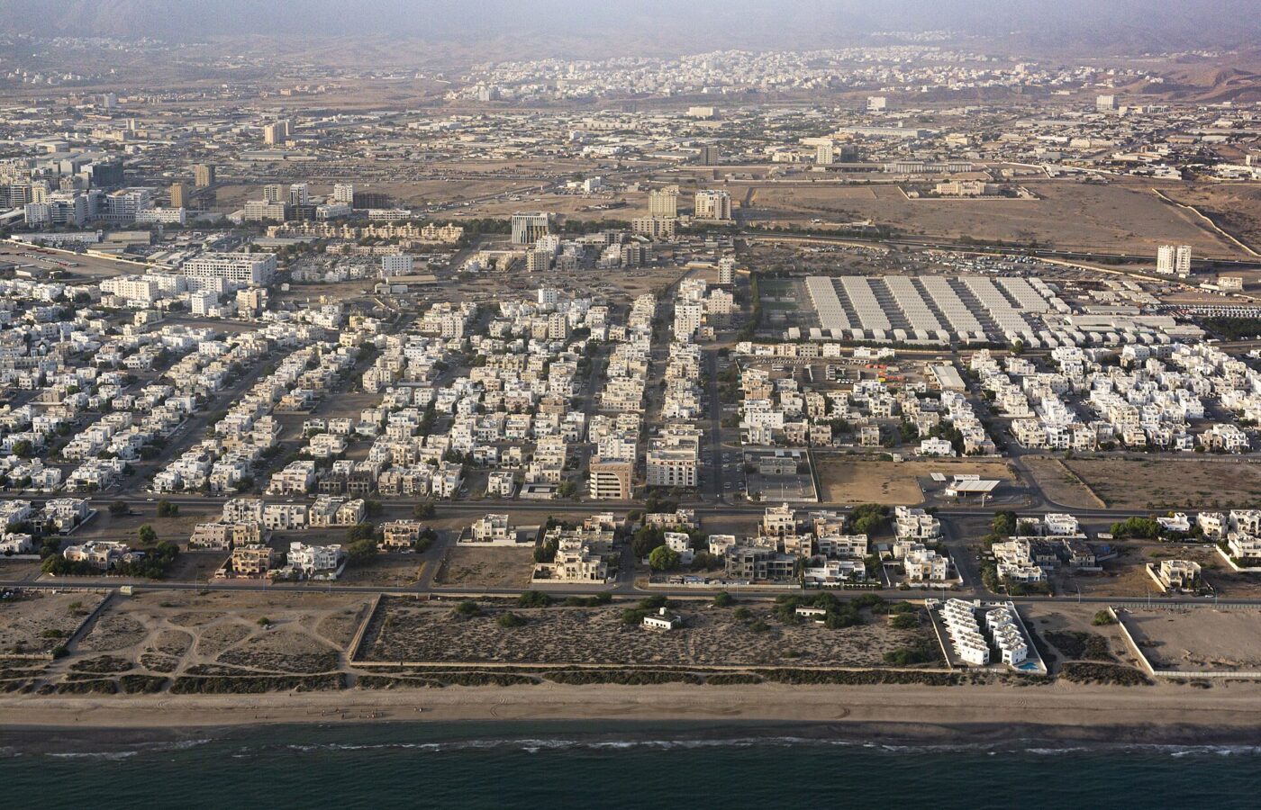 Aerial view of a Muscat residential district along the coastline