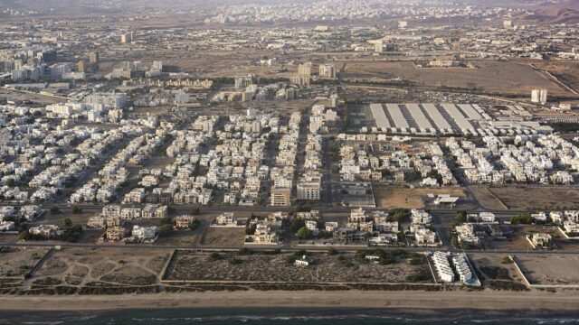Aerial view of a Muscat residential district along the coastline