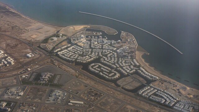 Aerial view of a planned coastal residential development near Muscat